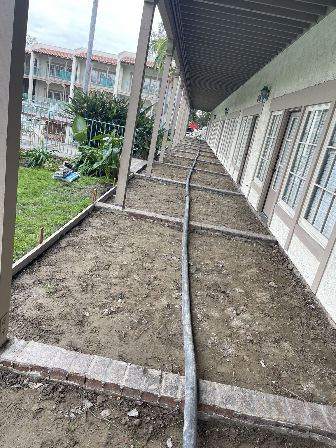 Commercial concrete walkway preparation by RC Masonry in Orange County